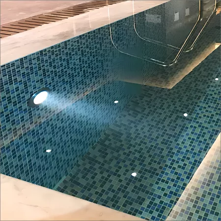 LED pool light fixture illuminating the water.