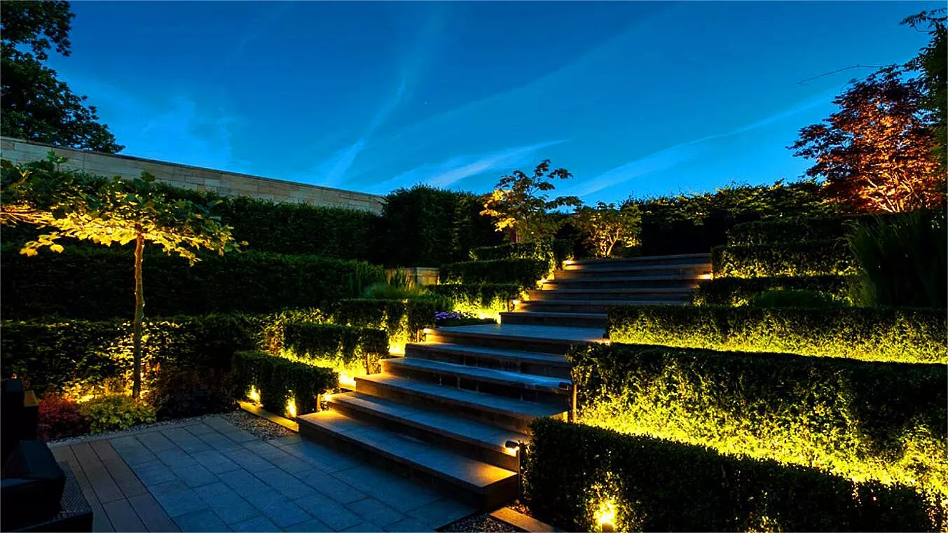 Outdoor step lighting illuminating a pathway at night.