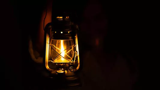 Traditional Chinese oil lamp on a wooden table