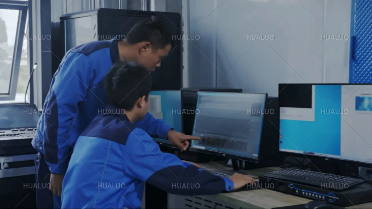 Operators discussing and programming the musical sequence for a fountain show.