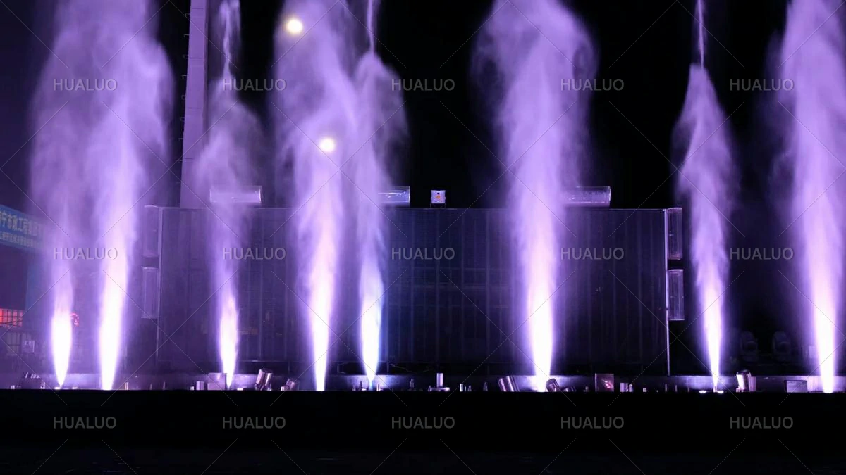 a powerful air-driven fountain nozzle creating an explosive mist-like water spray in the air.