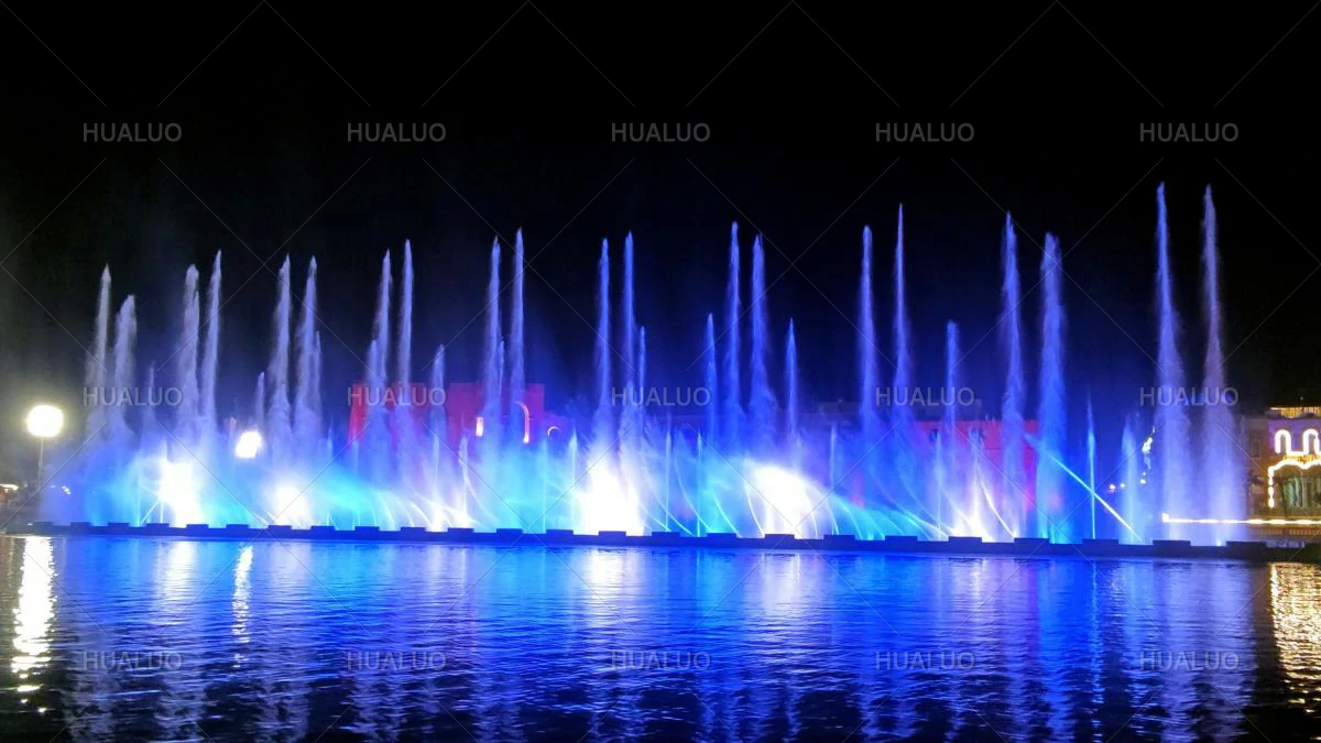 Nighttime operation of a floating “Red Castle” dance fountain in Libya, with water jets swaying from side to side.