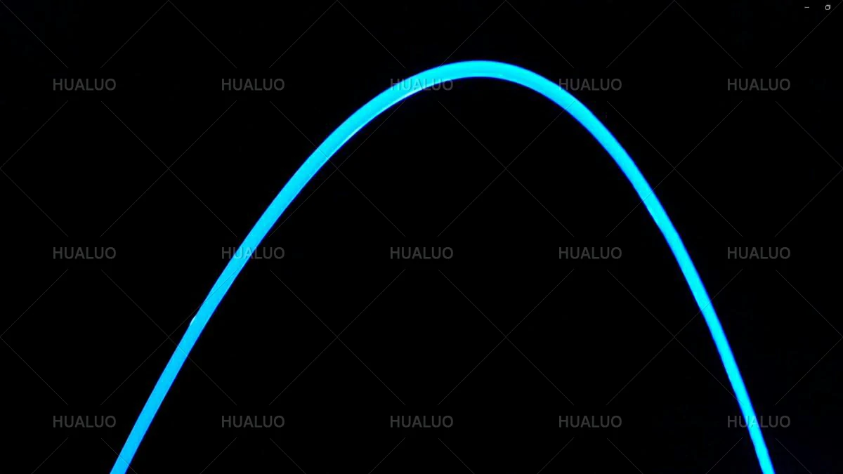 a single, smooth stream of water illuminated with a blue lighting effect.