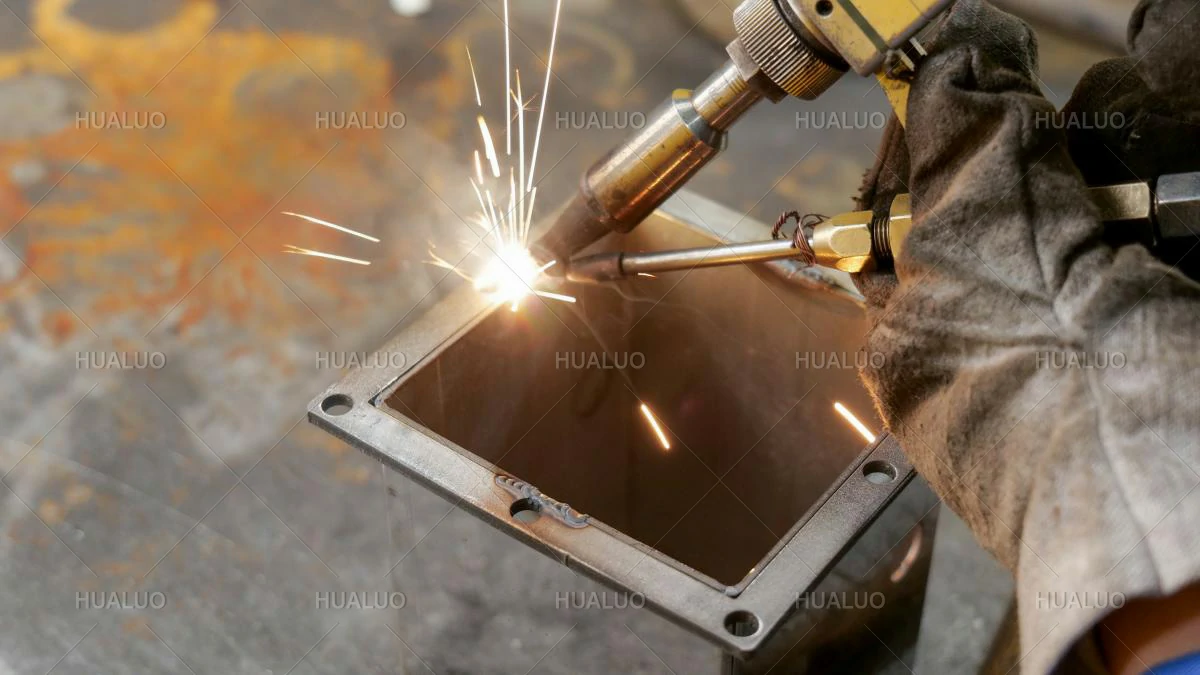 An close-up view of a precision welding operation on equipment.