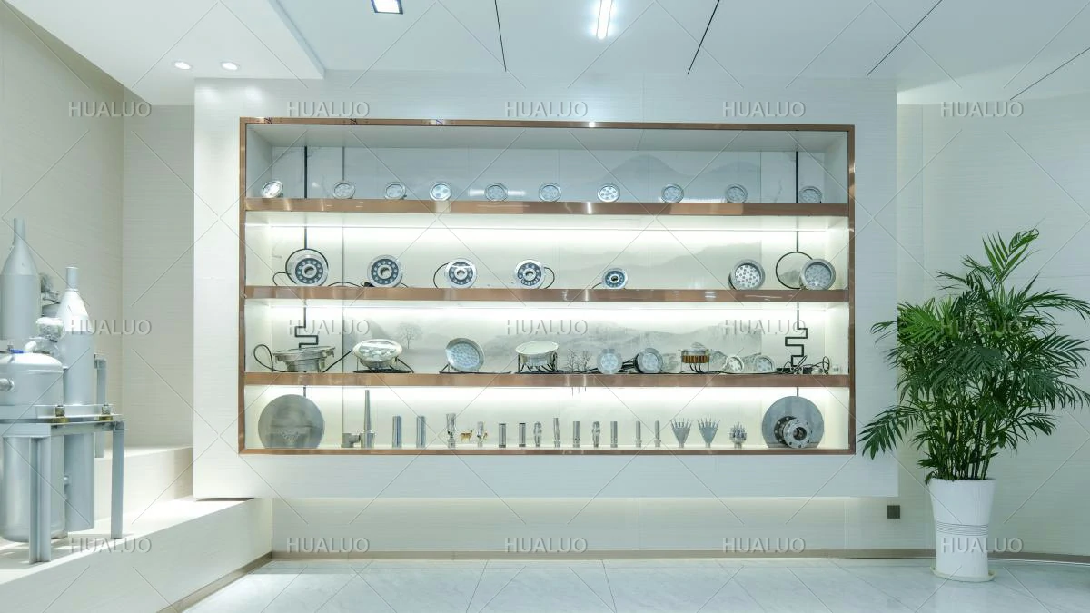 A display cabinet with the top three rows holding various types of fountain light fixtures, and the fourth row holding various fountain equipment nozzles.