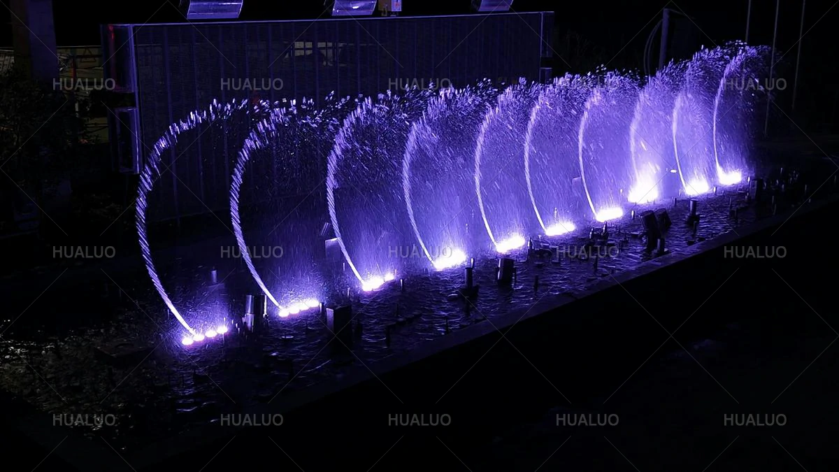 a fountain with swaying water patterns and integrated lighting effects.